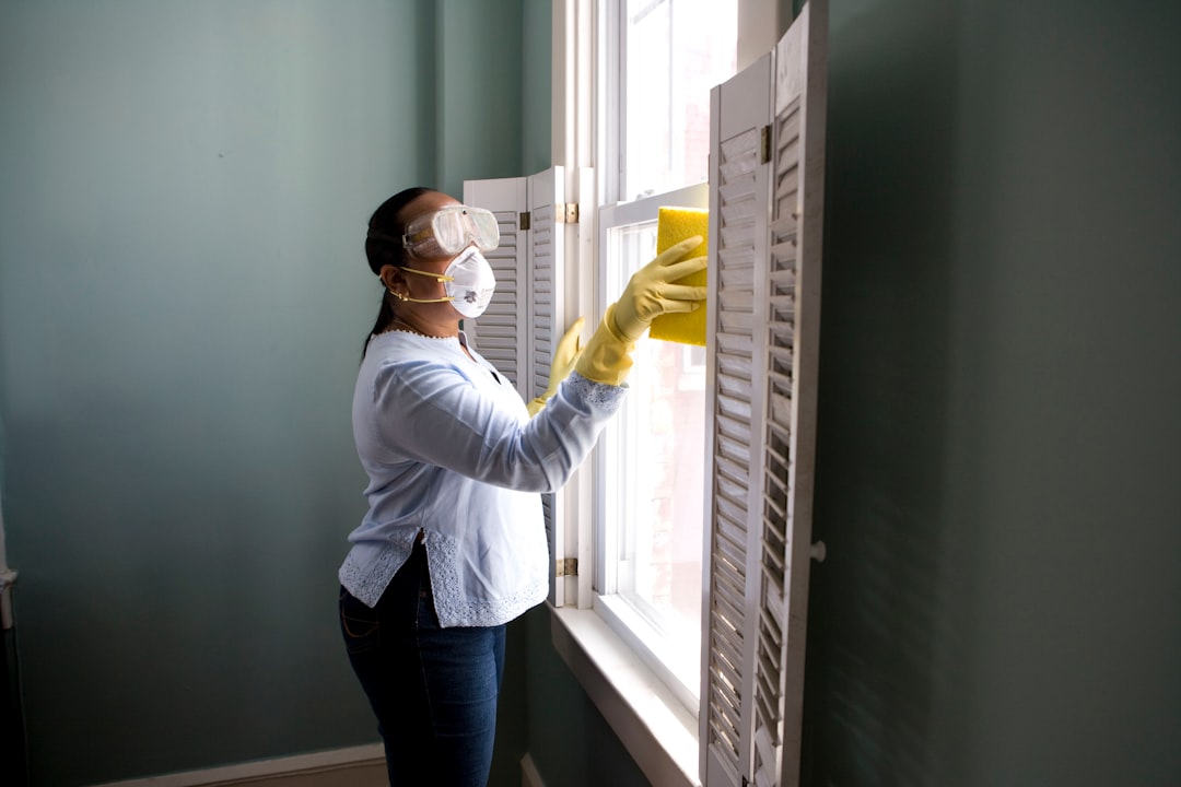 core-values When renovating a home, you should use a damp sponge or cloth to clean dust collected on a window sill, as the dust may contain asbestos or lead-based paint. Home maintenance is an ongoing process for any homeowner, and here we see an African- American woman who’d taken a damp sponge to her window’s frame, in order to remove accumulated dust particulates. Note how the homeowner had donned a pair of waterproof gloves, a facemask, and a pair of goggles, prior to beginning this task.